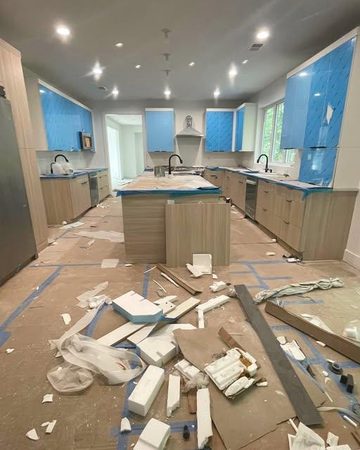 New kitchen still covered in protective film and construction debris